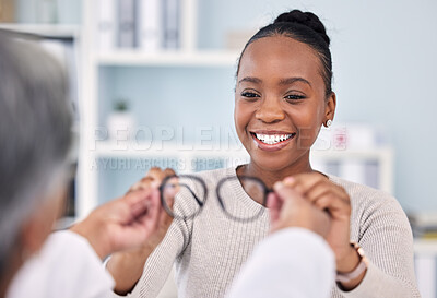 Buy stock photo Black woman, patient and doctor with glasses, eye care and vision consultation with optometrist, appointment and choice. Prescription lens, frame and help with smile, advice and optometry healthcare