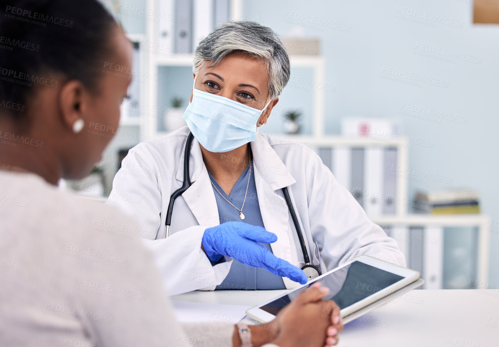 Buy stock photo Senior woman, doctor and tablet for consultation, checkup or diagnosis with mask and patient at hospital. Mature female person, medical nurse or surgeon consulting customer with technology at clinic