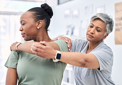 Buy stock photo Shoulder pain, physical therapy and chiropractor with patient, injury and healthcare with help and women at clinic. Physiotherapy, stretching muscle and anatomy with body, support and trust in health