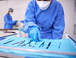 Nurse, surgery and tools in operation room, medical equipment and scissors for procedure. Surgeon, hospital and scrubs for protection, medical service and surgical tools in theatre for emergency