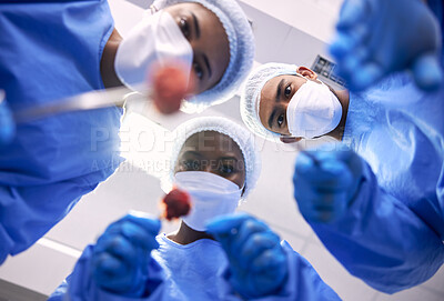Buy stock photo Patient pov, doctors and surgery in hospital for emergency, healthcare or medical procedure from below. Surgeon, nurse and medic teamwork with face mask, ppe and tools in clinic theater for operation