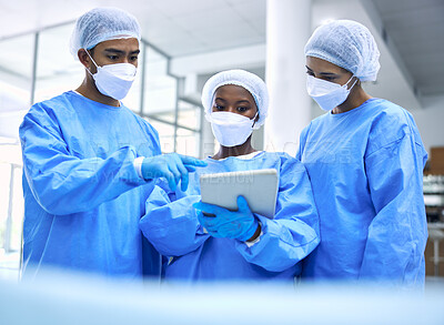 Buy stock photo Doctor, tablet and team with mask in meeting, planning or collaboration for surgery at hospital. Group of medical employees with technology in teamwork, consulting or healthcare strategy at clinic