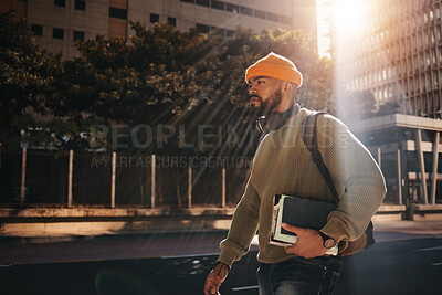 Buy stock photo Man in city street, university books and walking on morning commute to campus for education with backpack. Learning, opportunity and college student on road with school notebook, knowledge and sun.