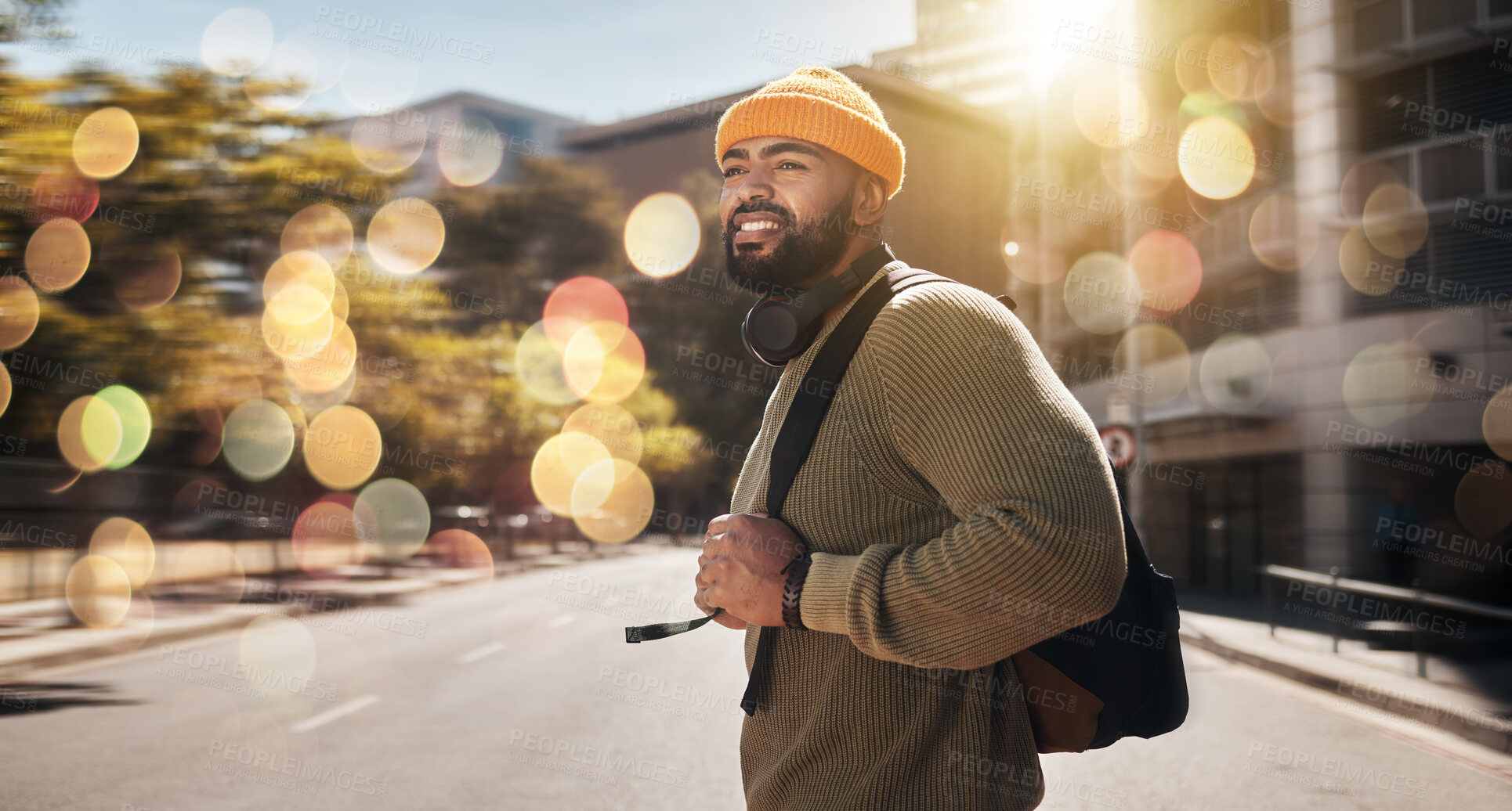 Buy stock photo City, travel and man with banner, walking and travel with student, fashion and casual outfit. Person, stylish and guy on the road, outdoor and bokeh with a cap, trendy and hipster with stylish outfit