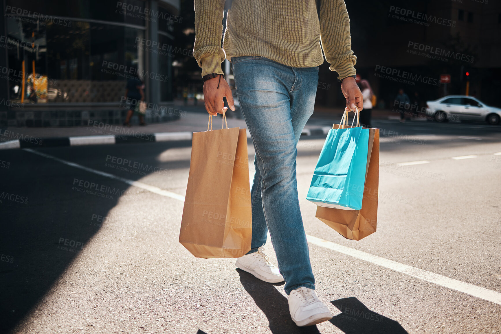 Buy stock photo Man, legs and shopping bags in street of city, pedestrian or crosswalk for travel, shop or mall. Male person or shopper walking on road with paper bag for discount, sale or retail store in urban town