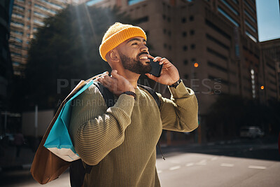 Buy stock photo Man, phone call and shopping bag outdoor with travel, walking and talking of deal, discount or retail sale in street. African person thinking of gift choice, package and mobile communication in city