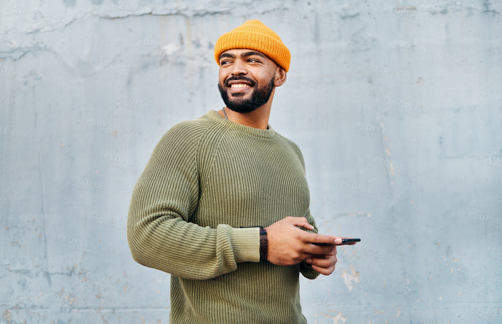 Buy stock photo Phone, smile and young man by wall networking on social media, mobile app or the internet. Technology, happy and male person from Colombia scroll on website with cellphone in city by gray background.