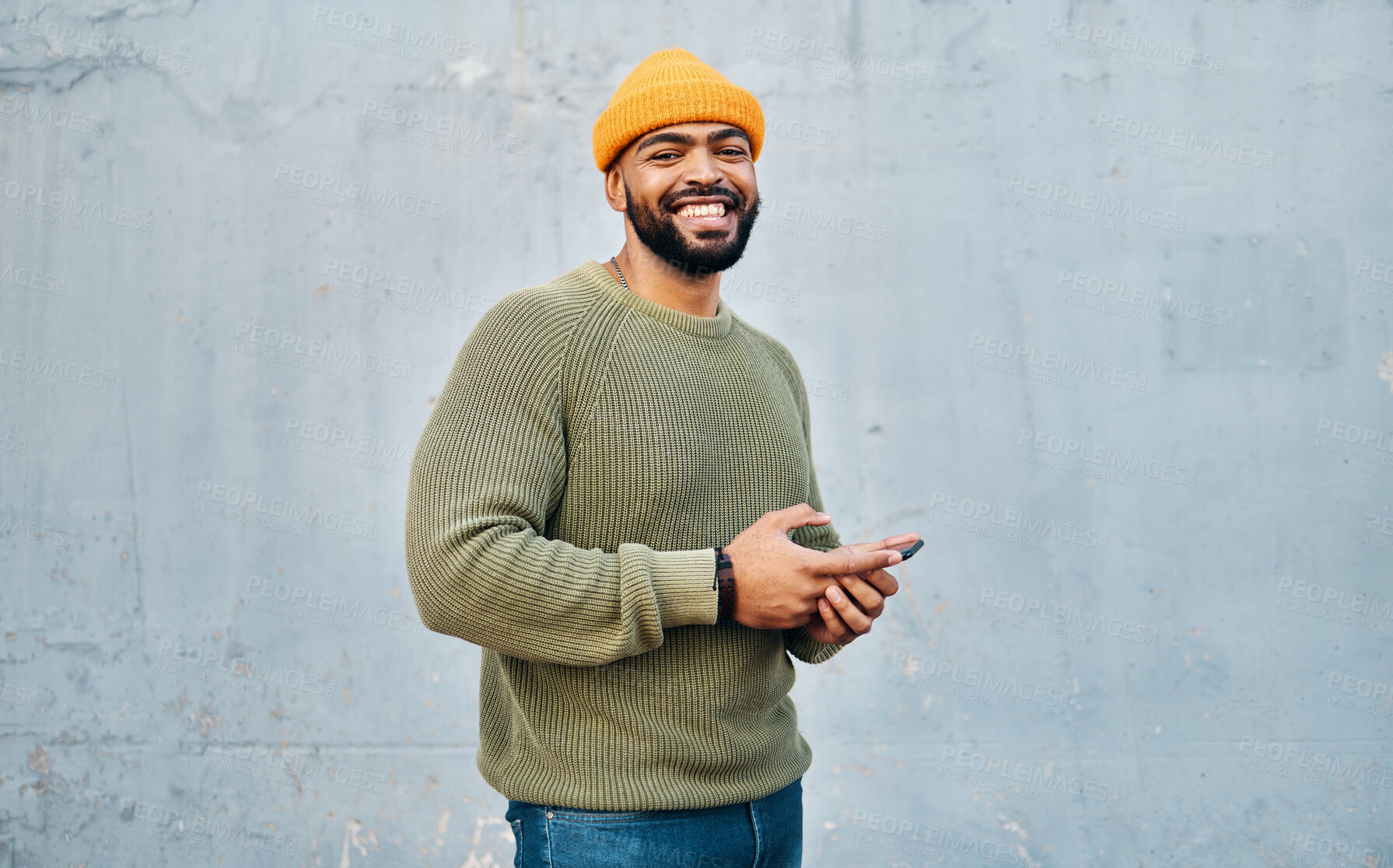 Buy stock photo Phone, portrait and young man by wall networking on social media, mobile app or the internet. Technology, happy and person from Colombia scroll on website with cellphone in city by gray background.