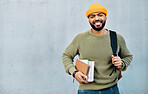 Portrait of happy man on wall background, university books and backpack on campus for education mockup. Learn, study and college student on grey space with information, knowledge and opportunity.