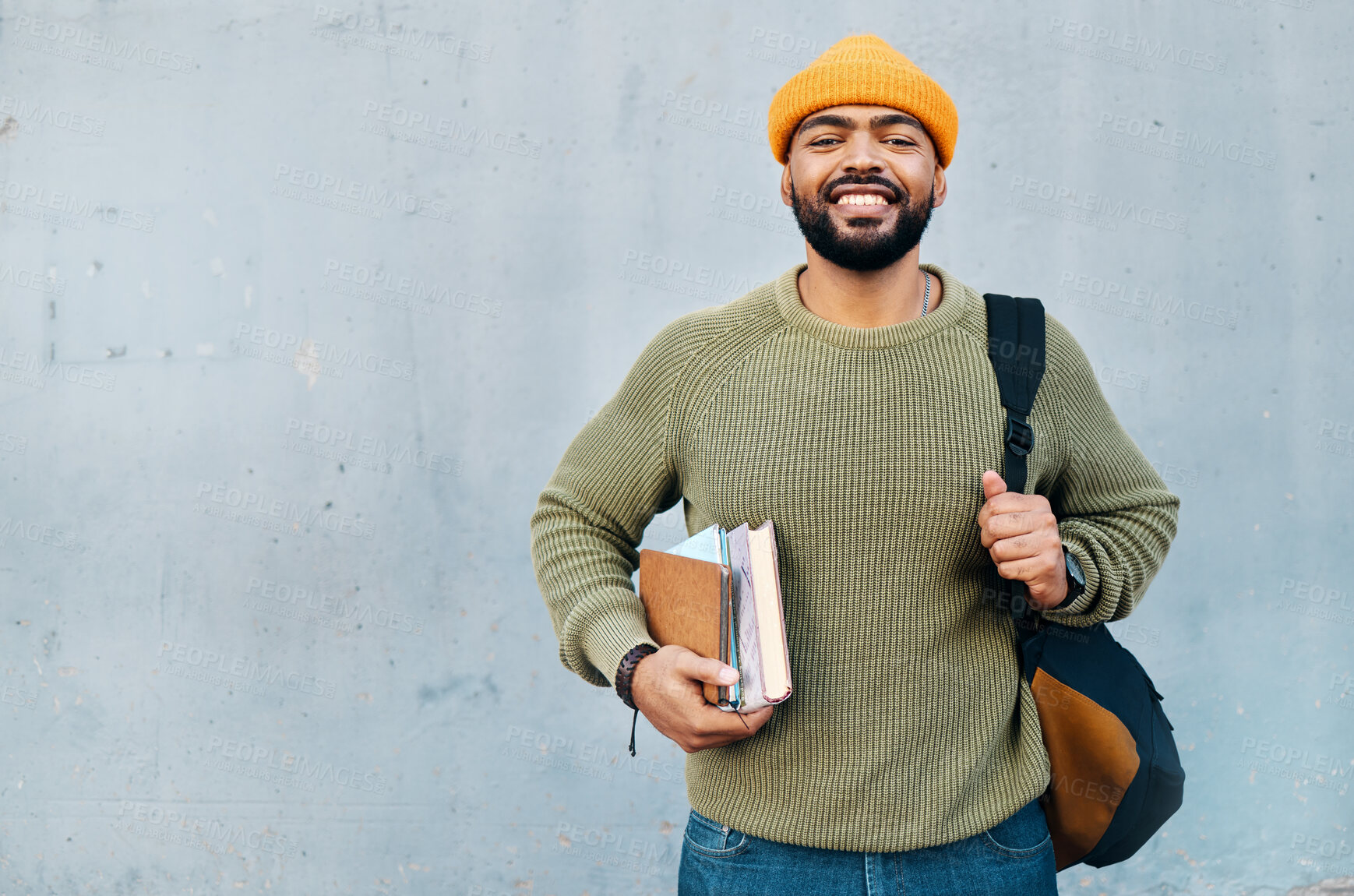 Buy stock photo Student, portrait and backpack with books for scholarship, university or college education and learning on wall background. Happy face of african man with his bag, notebook and studying or research