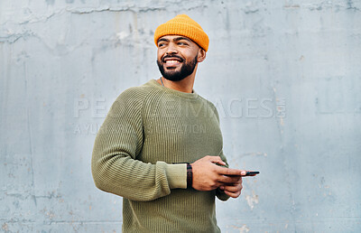 Buy stock photo Cellphone, smile and young man by wall networking on social media, mobile app or the internet. Technology, happy and male person from Colombia scroll on website with phone in city by gray background.