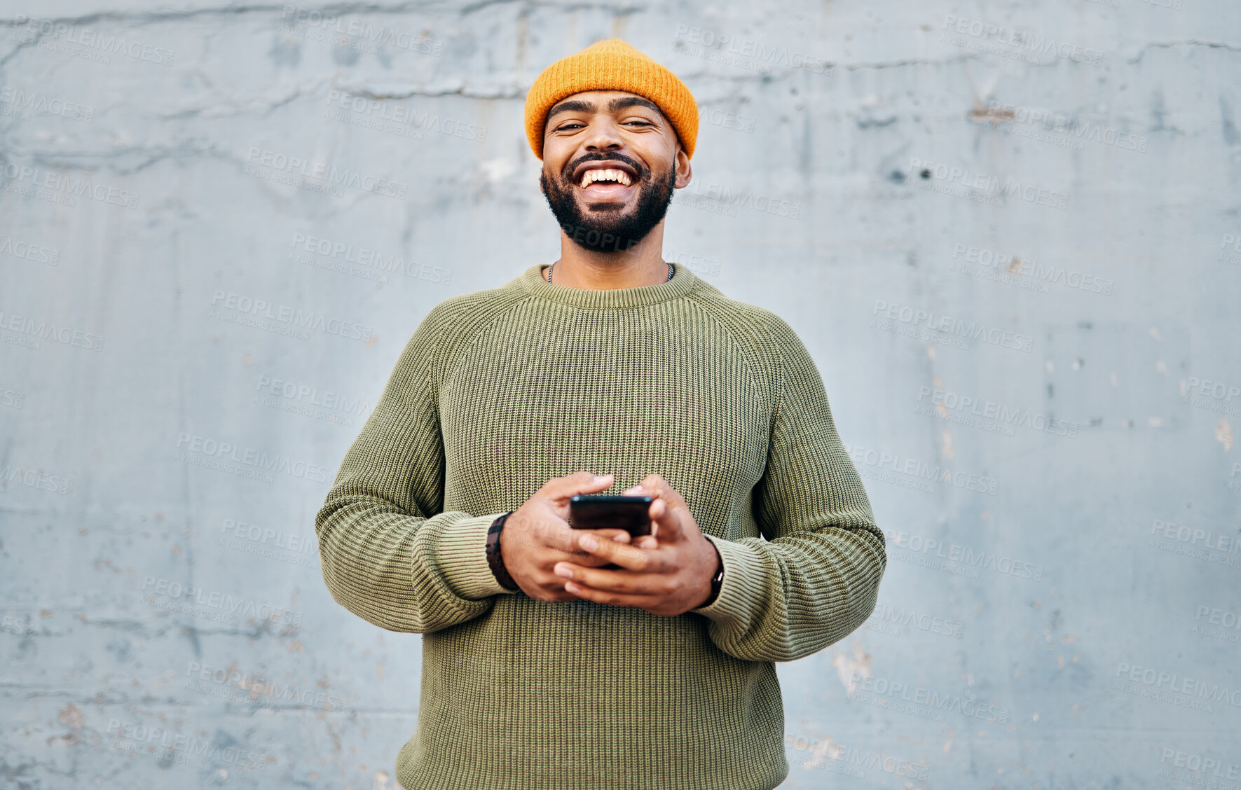 Buy stock photo Cellphone, smile and portrait of man by wall networking on social media, mobile app or internet. Technology, happy and person from Colombia scroll on website with cellphone in city by gray background