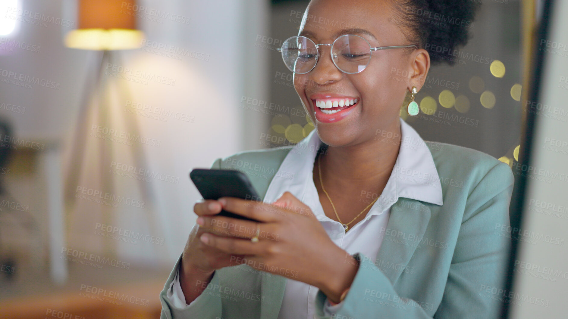 Buy stock photo Business woman, laugh and typing on cellphone for mobile chat, social networking and digital contact at night. Happy african worker scroll on smartphone, reading funny news and search media in office