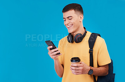 Buy stock photo Smile, phone and a student or man with a coffee on a blue background with mockup for social media. Happy, contact and a young gen z person reading from an app on a mobile with space for education