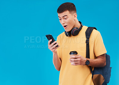 Buy stock photo Student, winner and man wow for phone news, college results or scholarship success on a blue background. Young person reading notification, winning and social media on mobile with surprise in studio