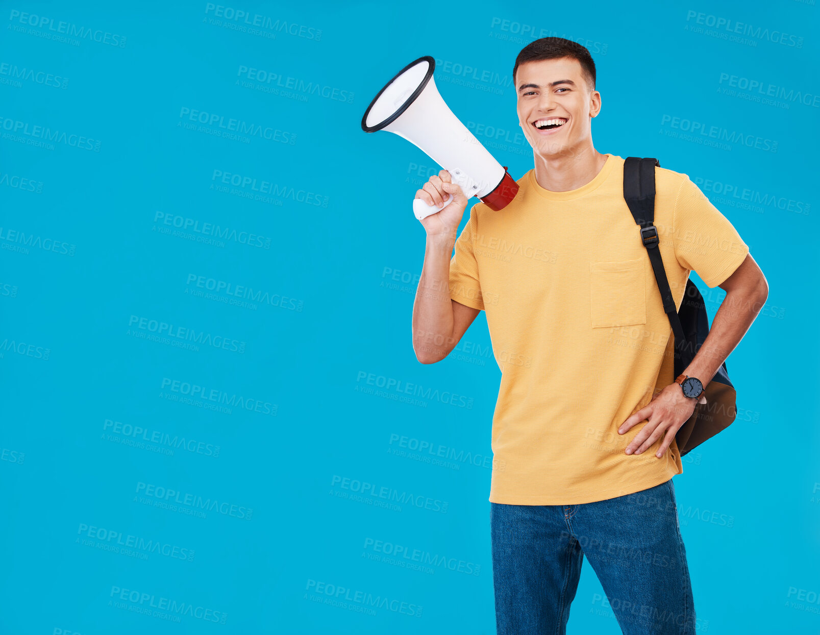 Buy stock photo Portrait, megaphone and man with a smile, announcement and promotion on a blue background. Person, activist and happy model with a bullhorn, change and happiness with justice, speech and mockup space