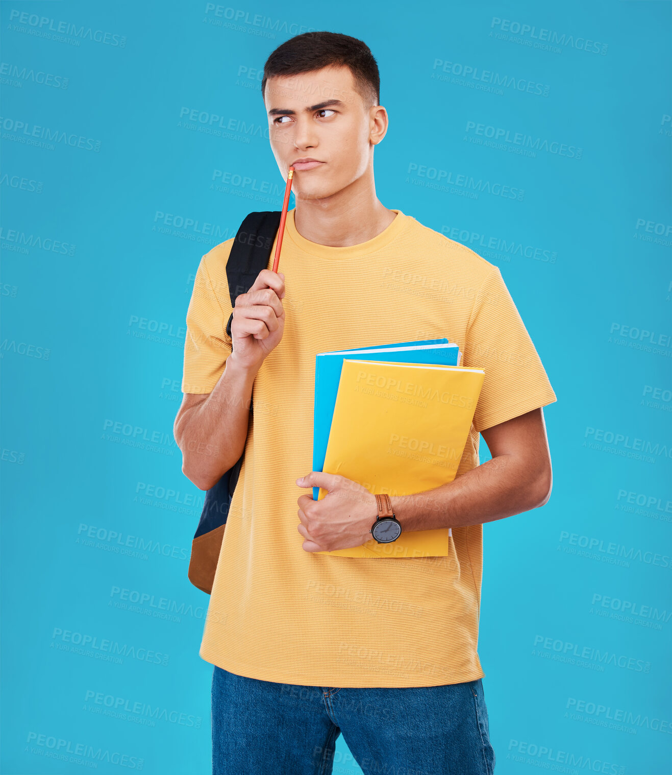 Buy stock photo Man, student thinking and choice for college, university or scholarship with books, research and funding solution in studio. Person with decision, confused or ideas for education on a blue background