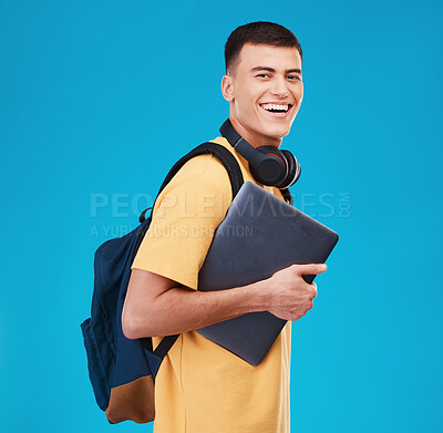 Buy stock photo Man, smile and laptop for education, student and portrait in studio by blue background, study and tech. Happy asian model, scholarship and online learning at university, registration and college