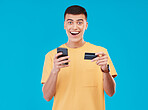 Credit card, portrait and man with a cellphone, payment and transaction with savings on a blue background. Person, ecommerce and model with a smartphone, digital app and online banking with finance