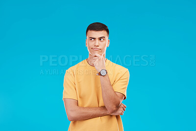 Buy stock photo Thinking, idea and young man in studio with decision, brainstorming or solution expression. Problem solving, planning and male model from Canada with reflection, memory or question by blue background