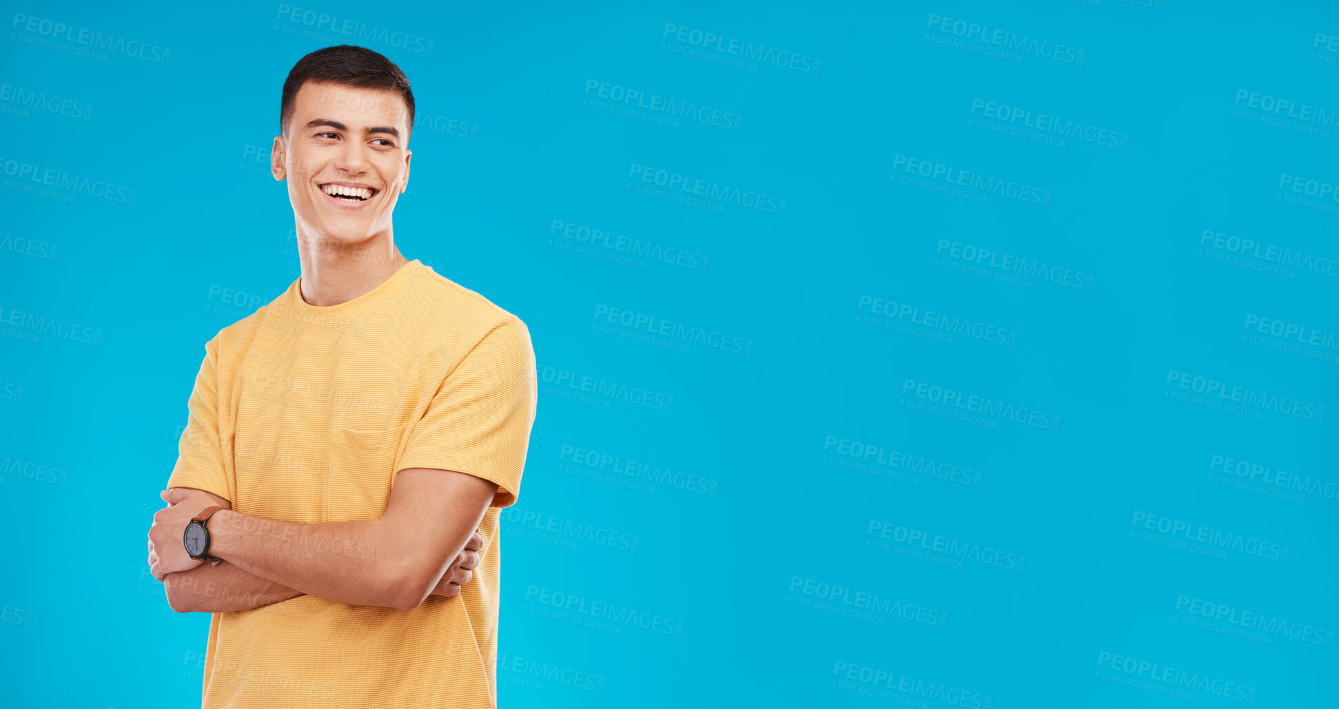 Buy stock photo Smile, crossed arms and man in a studio with mockup space for advertising, promotion or marketing. Happy, confidence and young male model from Canada with mock up isolated by blue background.