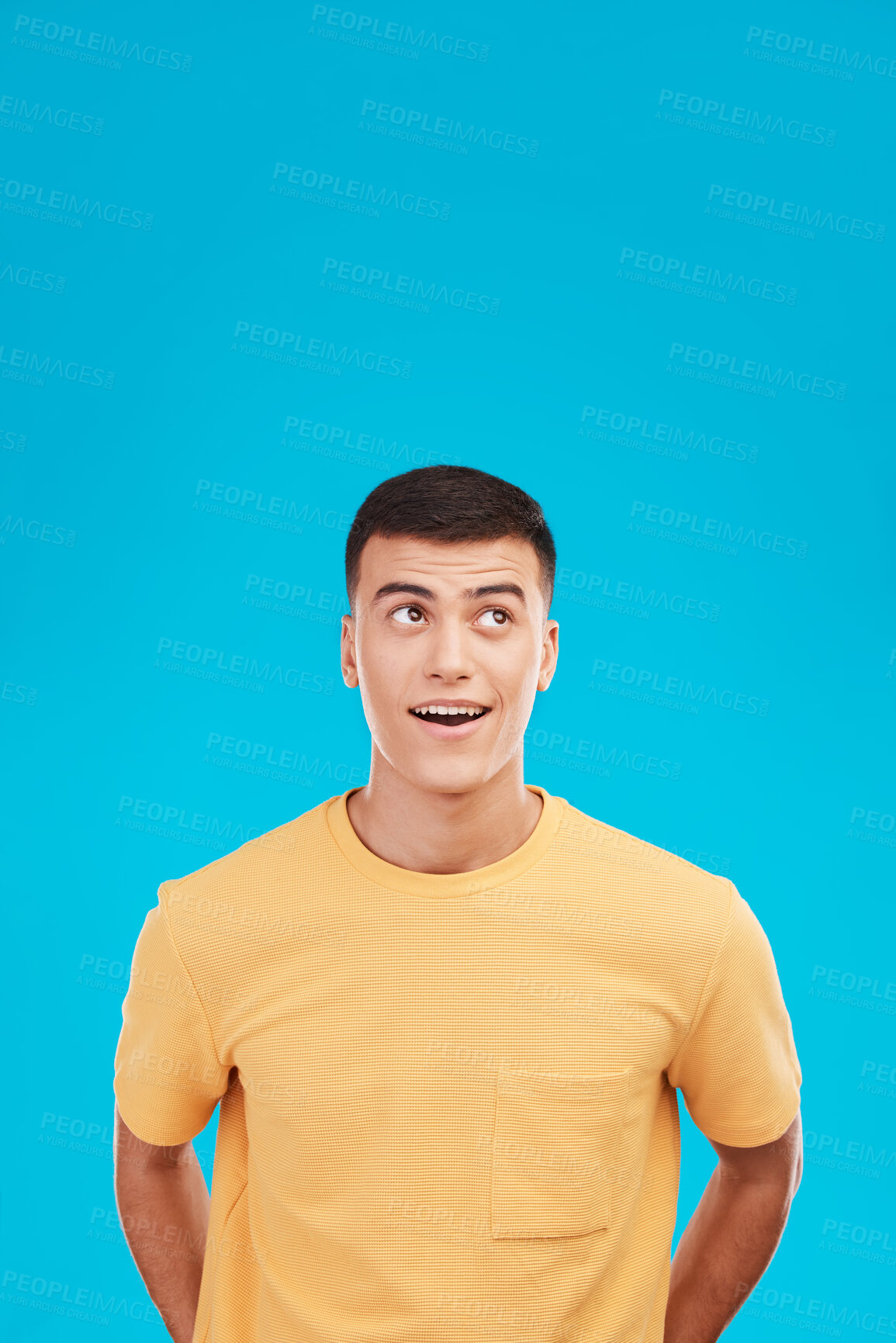Buy stock photo Man, face and thinking of idea with wow expression, surprised or open mouth in studio on blue background. Fashion, emoji and person on mock up space for deal, sale or discount announcement or news 