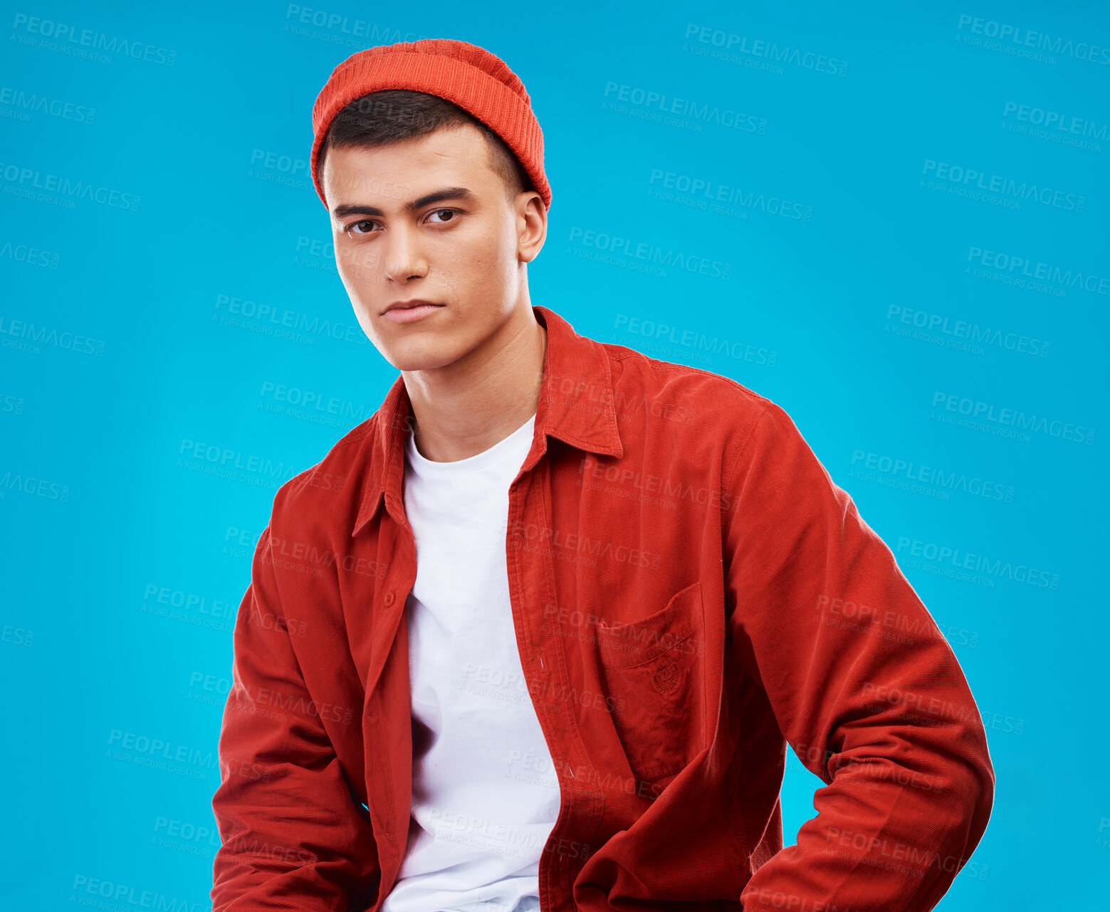 Buy stock photo Serious, fashion and portrait of man on a blue background for stylish, trendy or cool clothes. Outfit, shirt and a person or male model in clothing for a casual aesthetic with confidence on backdrop