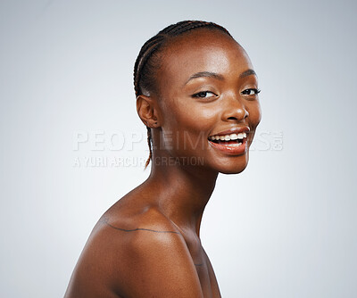 Buy stock photo Smile, glow and portrait of a black woman for skincare, dermatology and wellness on a studio background. Happy, face and an African girl or female model for cosmetics, skin health and beauty