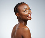 Smile, makeup and portrait of a black woman for skincare, dermatology and wellness on a studio background. Happy, face and an African girl or female model for cosmetics, skin health and beauty