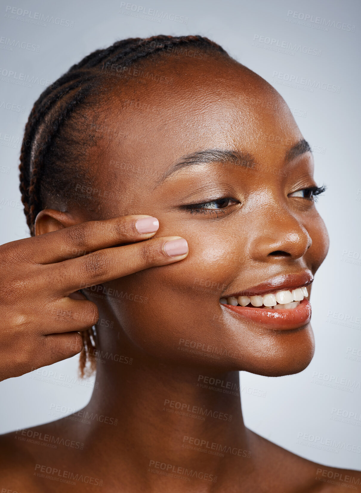 Buy stock photo Face, skincare and fingers on the cheek of a black woman in studio on a gray background for beauty or natural wellness. Skin, spa or luxury and a young model with cosmetic or antiaging treatment