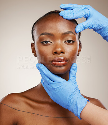 Buy stock photo Portrait, hands and plastic surgery with face of a black woman in studio on a gray background for cosmetic transformation. Gloves, beauty and change with a young model ready for facial treatment