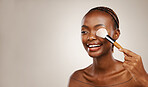 Skincare, black woman or makeup brush on eye for beauty, foundation or application in studio on brown background. Cosmetic, girl or face product for hygiene, aesthetic and mock up for facial or skin