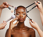 Tools, hands and portrait of black woman and cosmetics for getting ready, beauty product and glow. Brush, group and people with equipment for an African model, makeup and artist application in studio