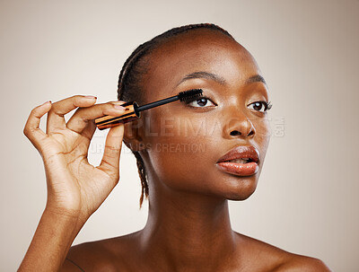 Buy stock photo Mascara, black woman and makeup for beauty cosmetics, makeover and eyelash extension in studio on brown background. Face, model and brush lashes for volume, skincare application and aesthetic tools 