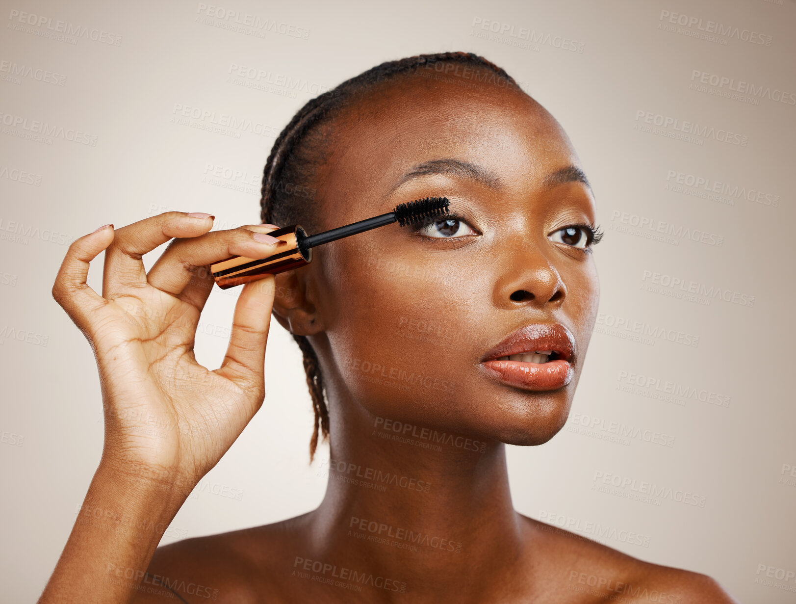 Buy stock photo Mascara, black woman and makeup for beauty cosmetics, makeover and eyelash extension in studio on brown background. Face, model and brush lashes for volume, skincare application and aesthetic tools 