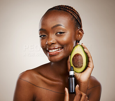 Buy stock photo Black woman, portrait and avocado oil with product, natural beauty and skincare with vegan cosmetics on brown background. Smile for dermatology, bottle with vegetable for liquid or serum in studio