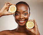 Black woman, lemon fruits and portrait of beauty in studio for vitamin c, vegan cosmetics and facial on brown background. Face of happy model, citrus nutrition and sustainability for natural skincare