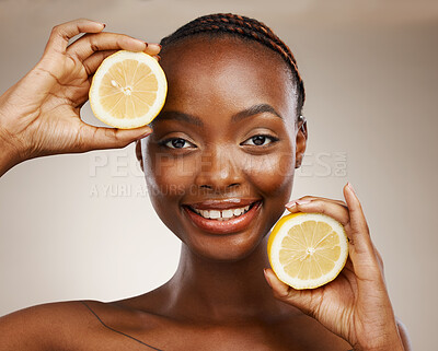 Buy stock photo Black woman, lemon fruits and portrait of beauty in studio for vitamin c, vegan cosmetics and facial on brown background. Face of happy model, citrus nutrition and sustainability for natural skincare