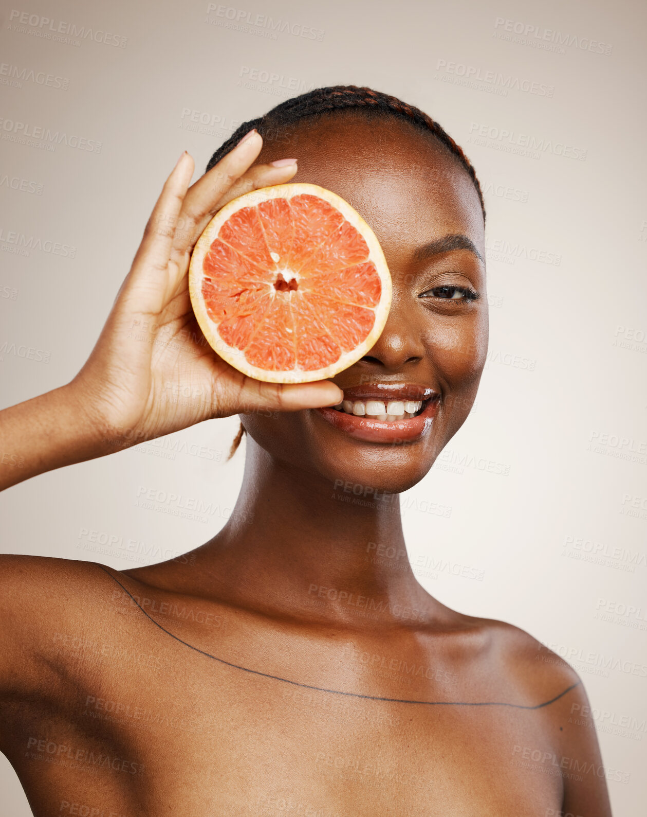 Buy stock photo Happy woman, grapefruit and portrait of skincare in studio for vitamin c, vegan cosmetics and glow on brown background. Face, african model and citrus nutrition for healthy benefits of natural beauty