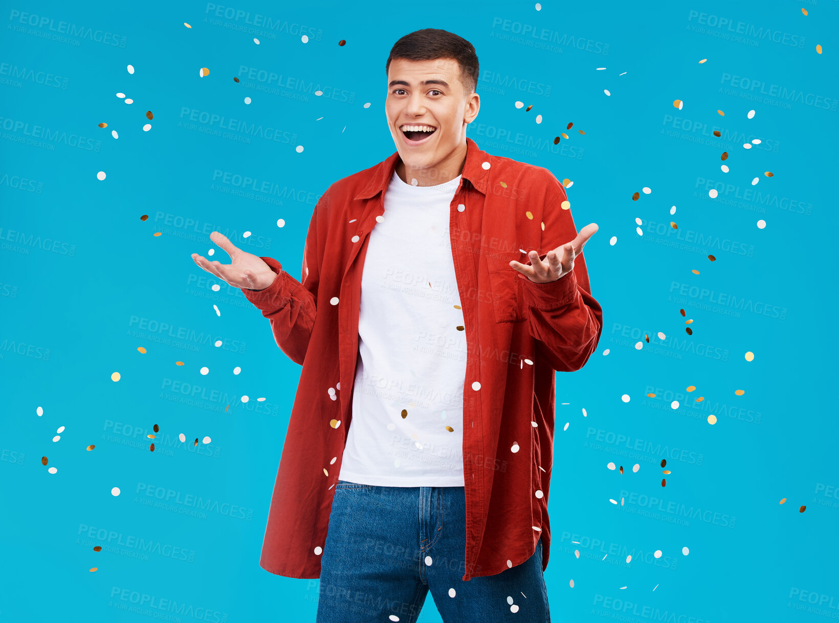 Buy stock photo Portrait, confetti and man with celebration, achievement and excited on a blue background. Person, guy and model with sparkle, success and happiness with surprise, wow and omg with victory or winning