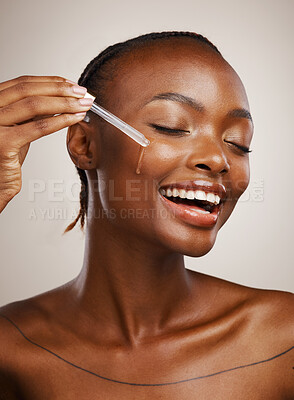 Buy stock photo Happy woman, skincare and serum on face in studio for beauty, dermatology or collagen on brown background. African model, facial cosmetics and liquid dropper of hyaluronic acid, essential oil or glow