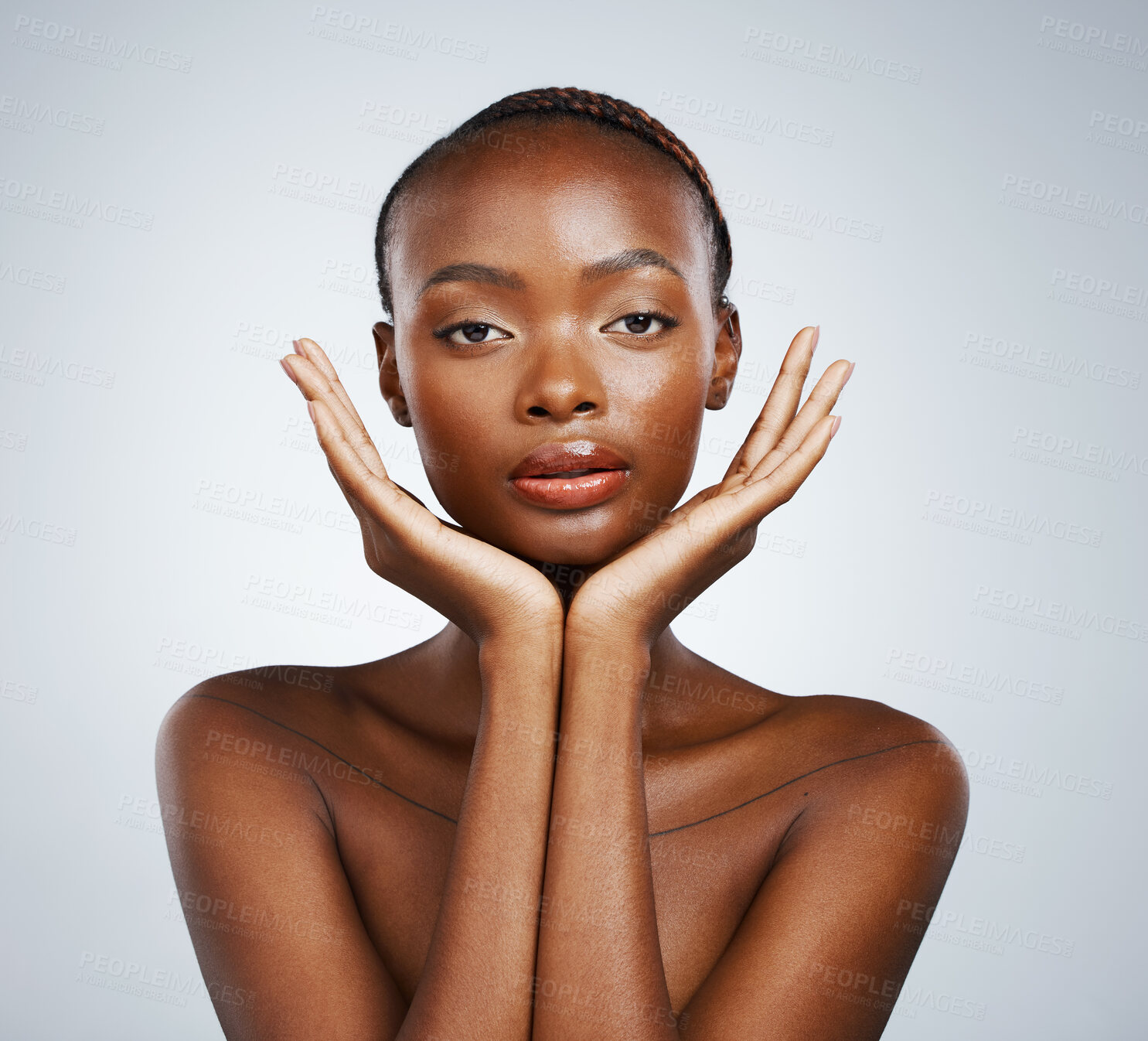 Buy stock photo Portrait, skin and hands of a black woman in studio on a gray background for skincare, beauty or natural wellness. Face, spa or luxury and a young model with cosmetic or antiaging aesthetic treatment