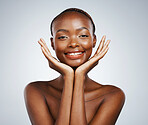 Portrait, smile and hand frame with a black woman in studio on a gray background for beauty or natural wellness. Skincare, spa or luxury and a young model with cosmetic or antiaging treatment