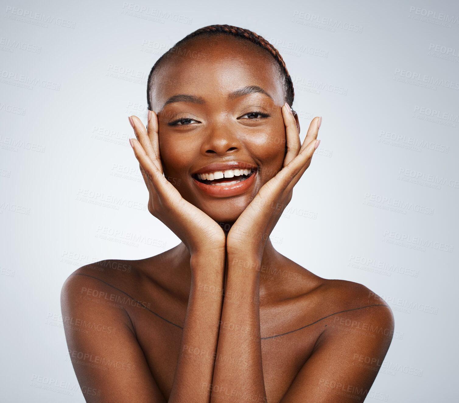 Buy stock photo Portrait, beauty and hands on the cheek of a black woman in studio on a gray background for skincare or natural wellness. Smile, spa or luxury and a young model with cosmetic or antiaging treatment