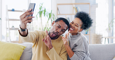 Buy stock photo African couple, selfie and sofa with peace sign, smile or funny face on blog, love or bonding in home. Black woman, man and photography for memory, profile picture or comic social media post in house