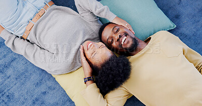 Buy stock photo Top view, home and black couple with love, marriage and romance with bonding, relationship and relax together. Happy, African man or woman on the ground, hug or romantic with happiness, trust or care