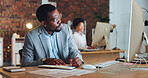 Planning, black man and writing notes in office with business  agenda, administration or review of schedule. Businessman, notebook and report on computer research, information or reminder in journal