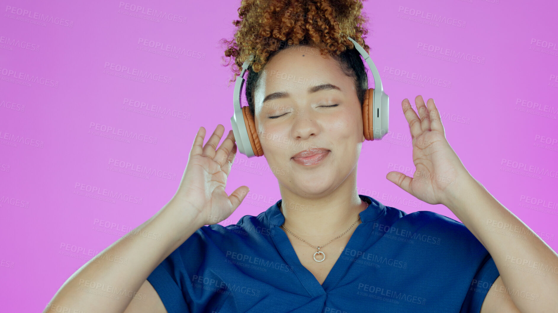 Buy stock photo Headphones, music and face of woman in studio listening to song, audio and radio for freedom. Podcast, technology and happy person for streaming subscription, relax and fun on purple background