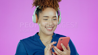 Buy stock photo Headphones, happy and woman with phone in studio listening to song, audio and radio. Music, smile and face of person with smartphone for streaming subscription, relax and fun on purple background