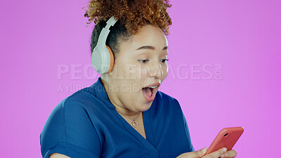 Buy stock photo Woman, phone and wow with headphones for winner, promotion or announcement in studio on purple background. Smartphone, person and surprised for notification, sale and lottery news with mock up space